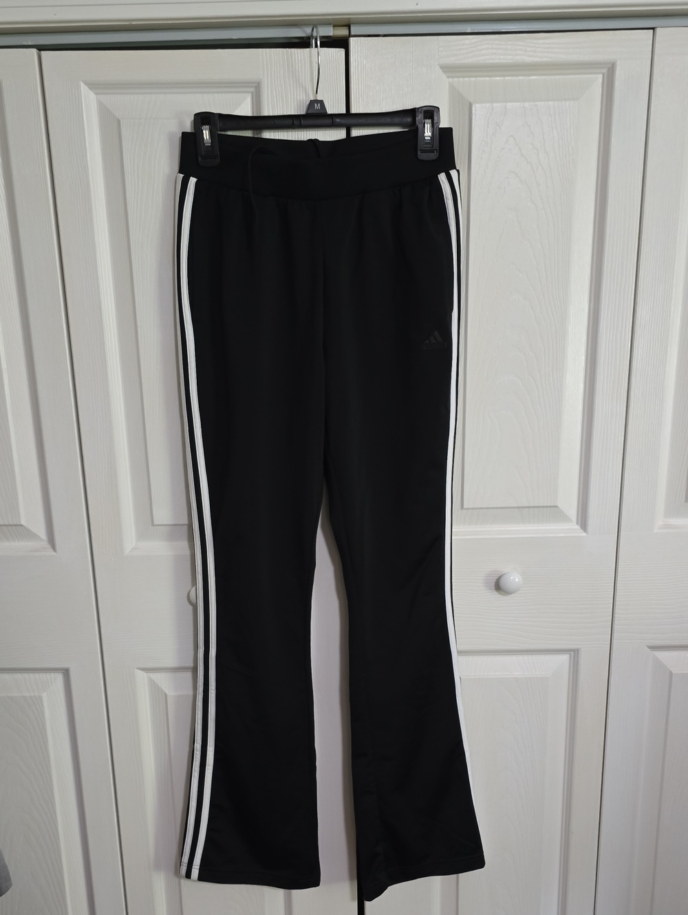 Adidas Black Sweatpants with White Side Stripes.